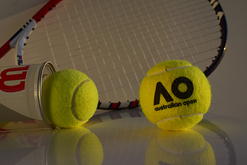 Thumbnail of the original photo with tennis balls and a racquet with a small light