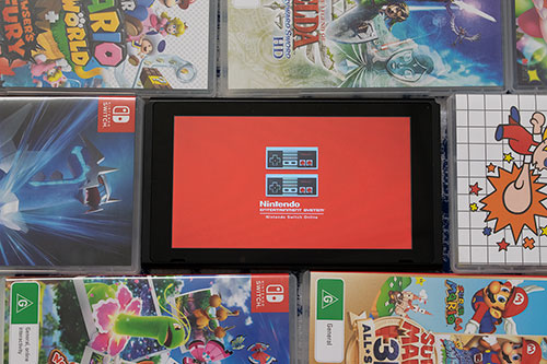 Original photo of nintendo switch screen surrended by games