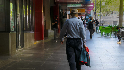 Thumbnail of visual narrative: represent a man walking in the street with a nice light effects